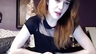 Cute gal uses a vibrator on her muff, while on webcam