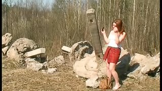 Pissing on a rock is a cute redhead