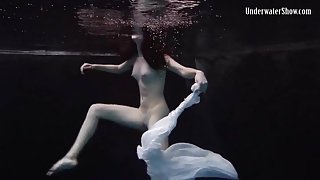 Balletic underwater swimming with a teen beauty